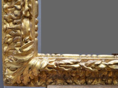 null Large upside down profile FRAME in carved and gilded wood decorated with a frieze...
