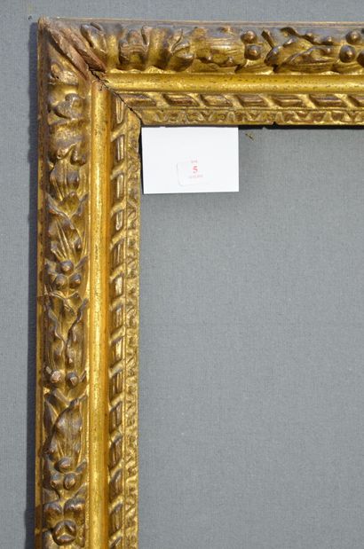 null Carved and gilded oak frame decorated with friezes of water leaves, twisted...