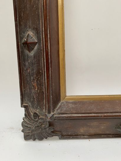 null Reverse sloping walnut frame with a rhythm of quatrefoils and palmettes at the...