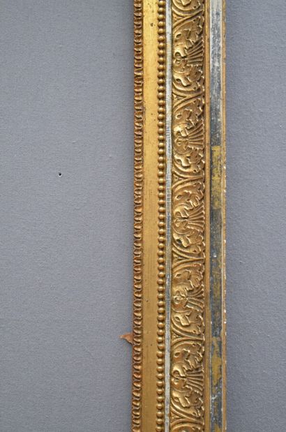 null Wooden frame and gilded paste with raise-of-heart decoration, friezes of pearls...