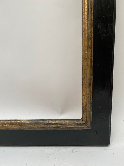 null Cassetta" frame with upside down profile in blackened and gilded wood 

Spain,...