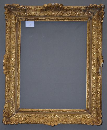 null Carved and gilded oak frame with Bérain decor. (accidents and misses)

Louis...