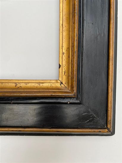 null CADRE dit "à Cassetta" à profil renversé en bois noirci et doré.

Italie, XVIIème...