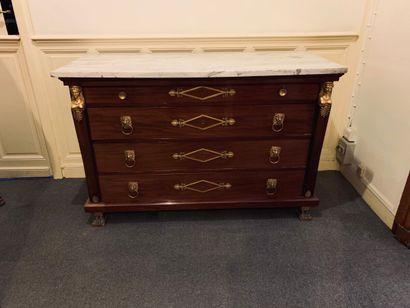 null A mahogany and mahogany veneer COMMODE opening to four drawers in four rows,...