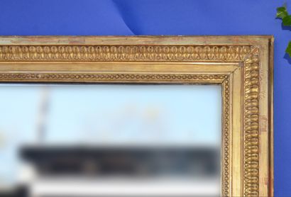 null Large Mantelpiece mirror with wood and gilded stucco frame with friezes of parles...