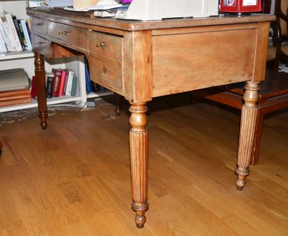 A flat mahogany and mahogany veneer desk...