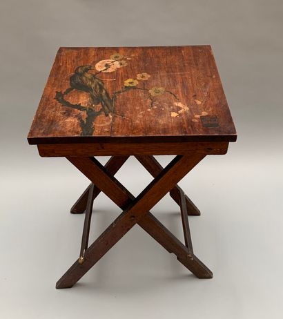 null Square table in natural wood with painted decoration of a bird, folding base....