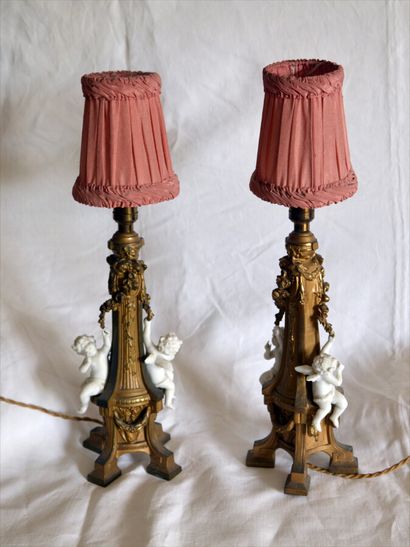 Pair of bronze lamps with Amours in biscuit...