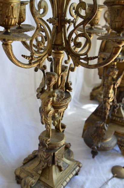 null Renaissance style ormolu mantel set with a picture of love

19th century

Height...