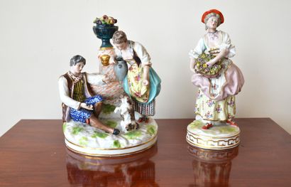 Two polychrome porcelain groups: The flower...