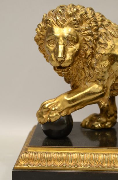  School of the XIXth century 
Lion of the Villa Medici 
Gilded bronze with a medallion...