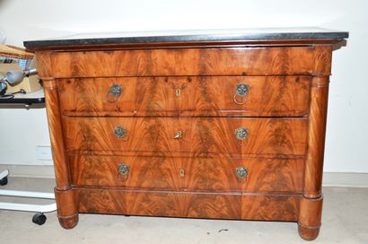 null A mahogany veneered half-column chest of drawers opening with four drawers,...