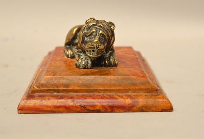null School of the XIXth century

Reclining Lion

Silvered and gilded bronze on a...