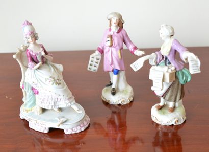 null Three polychrome porcelain groups Musical scene (one hand to be glued back)

Circa...
