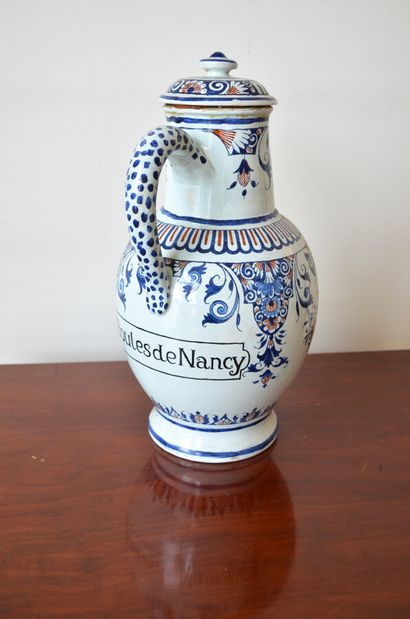 null A large earthenware PICTURE with mantling decoration, marked "Boules de Nancy".

Rouen...