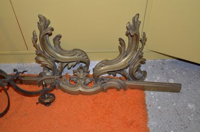 Two gilt bronze andirons fronts and its bar...