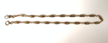  Gold (750) and silver (800) WATCH CHAIN with olive link. 
Weight: 26.4 g. Length:...