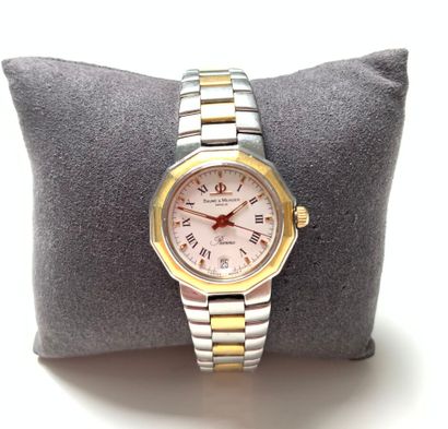 null BAUME and MERCIER

LADY'S BRACELET WATCH in steel and gilt metal, round dial...