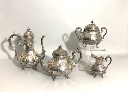 null SERVICE A THE CAFE four pieces in silver with decoration of ribs and shells...