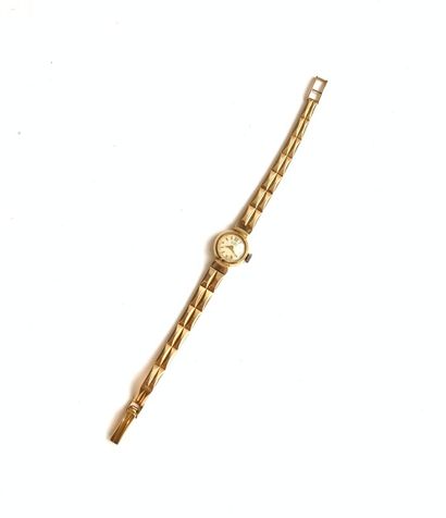 null BRACELET LADY'S WATCH in gold (750), round bezel, gilt dial, applied baton hour...