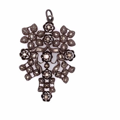 null A silver (800) openwork pendant with a floral design enhanced by diamond-set...