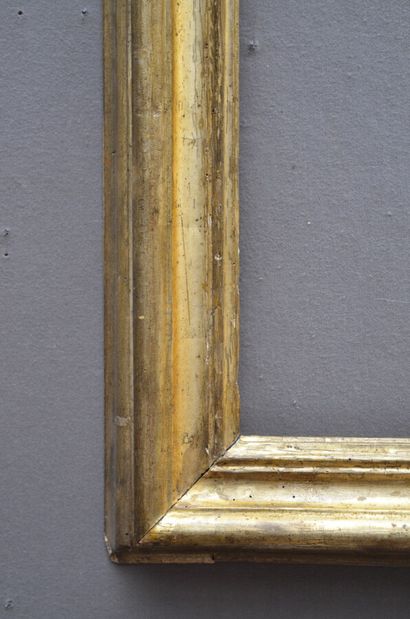 null A moulded and gilded wooden frame with an upside down profile (small missing...