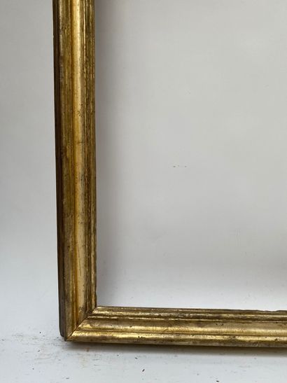 null A moulded and gilded wooden frame with an upside down profile (small missing...