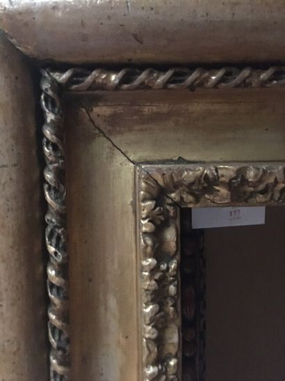 null A "Carlo Maratta" molded and gilded wood frame, carved with water leaves, twisted...