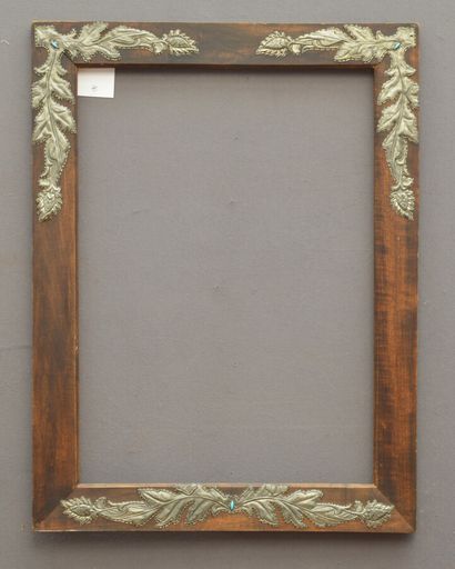null Wooden frame decorated in the corners with applied leafy scrolls in moulded...