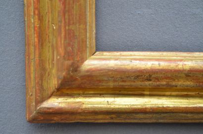 null A moulded and gilded wooden frame with a reversed profile (modified in its dimensions)

Italy,...