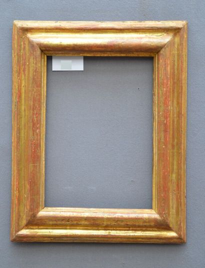 null A moulded and gilded wooden frame with a reversed profile (modified in its dimensions)

Italy,...