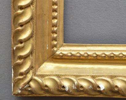 null Carved and gilded oak frame decorated with heart-shaped raisins and a frieze...