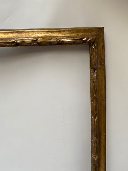null A moulded, carved and gilded wooden frame with laurel decoration. 

Italy, 18th...