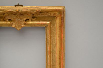 null A small carved and gilded oak frame with a sandblasted background and a pediment...