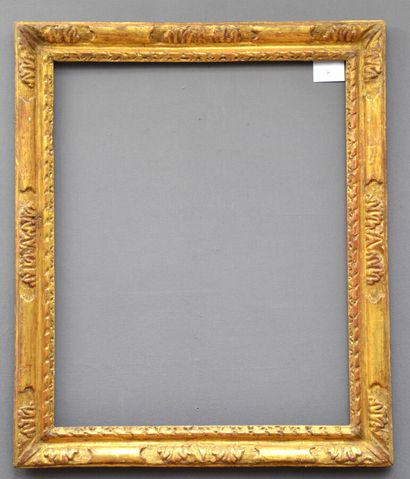 Carved and gilded oak frame decorated with...