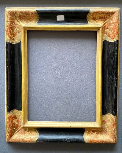Blackened and gilded moulded wood frame,...