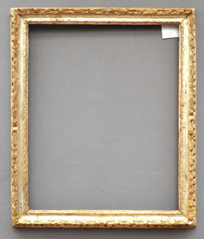 Carved and silvered wooden frame with laurel...