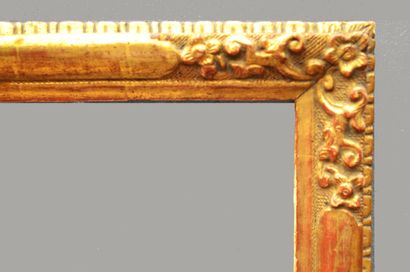 null Small carved and gilded wooden FRAME with plain reserve in the middle and flowers...