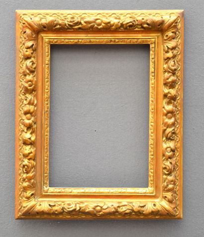 null Wood and stucco frame decorated with garlands of flowers and acanthus leaves...