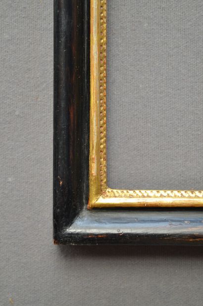 null Blackened moulded wood frame, gilded rebate decorated with a herringbone pattern

19th...