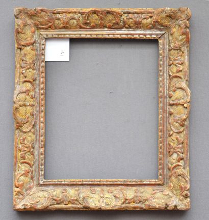 null Carved oak frame, formerly silvered with Bérain decoration

Louis XIV period

31,5...