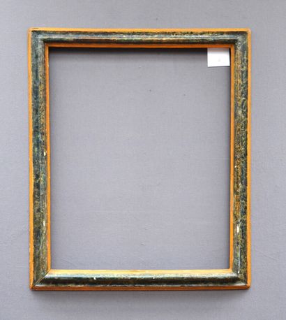 A yellow and green marbled wood frame with...