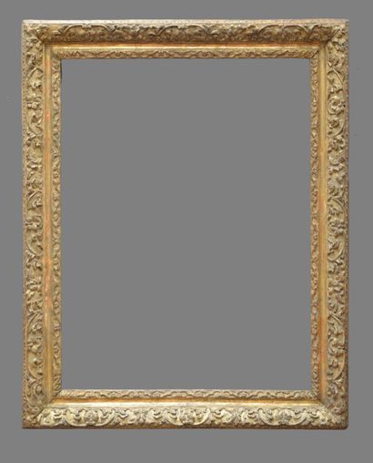 null Carved and gilded oak frame with water leaves and Bérain decoration. (resealed)

Louis...
