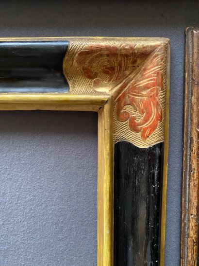  Blackened and gilded moulded wood frame, the corners decorated with large acanthus...