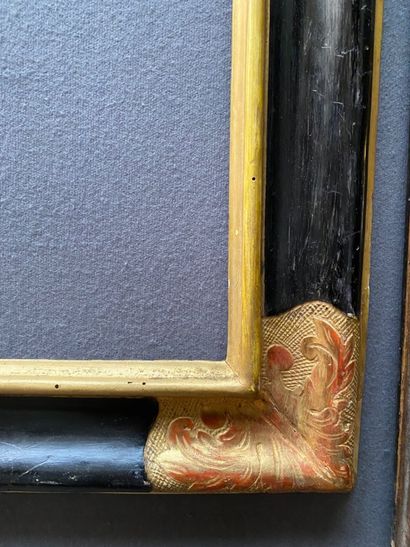  Blackened and gilded moulded wood frame, the corners decorated with large acanthus...