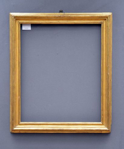 null A Salvator Rosa moulded and gilded wood frame with a Sienna yellow background....