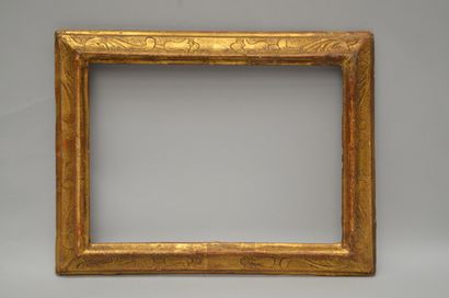A moulded and gilded wooden frame with acanthus...