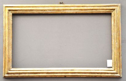 A moulded and silvered wooden frame with...