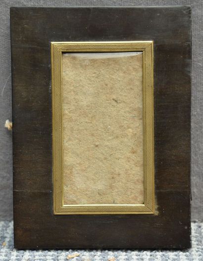 null A small ebony veneered frame with a flat profile, gilded brass rebate and burr...
