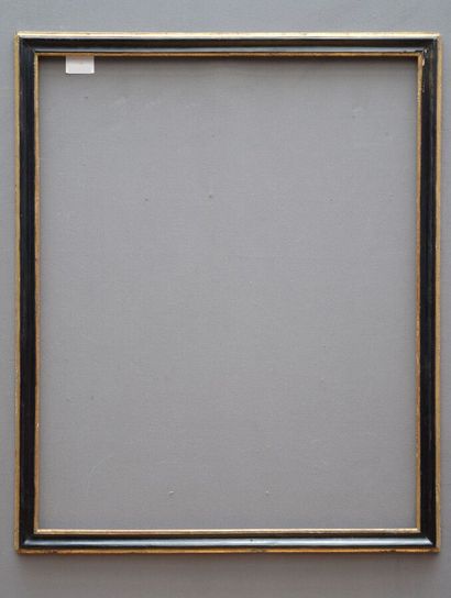A moulded and blackened fir frame with a...